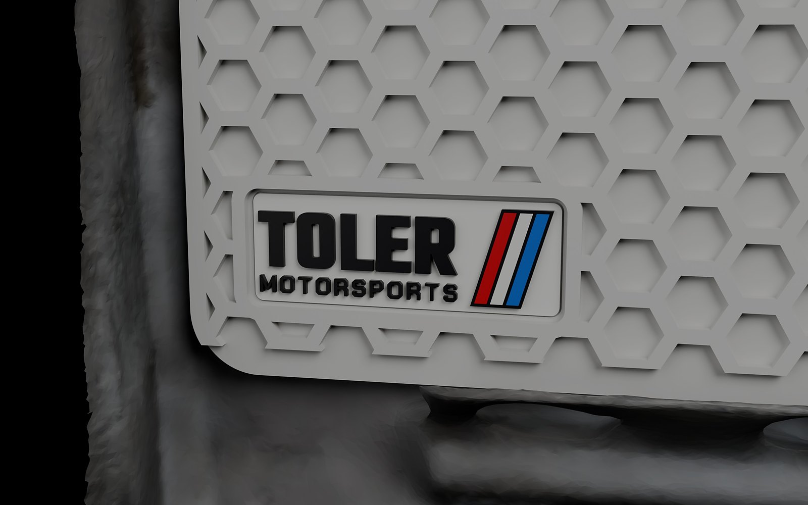 Toler Motorsports badge in the lower left corner of the hex face