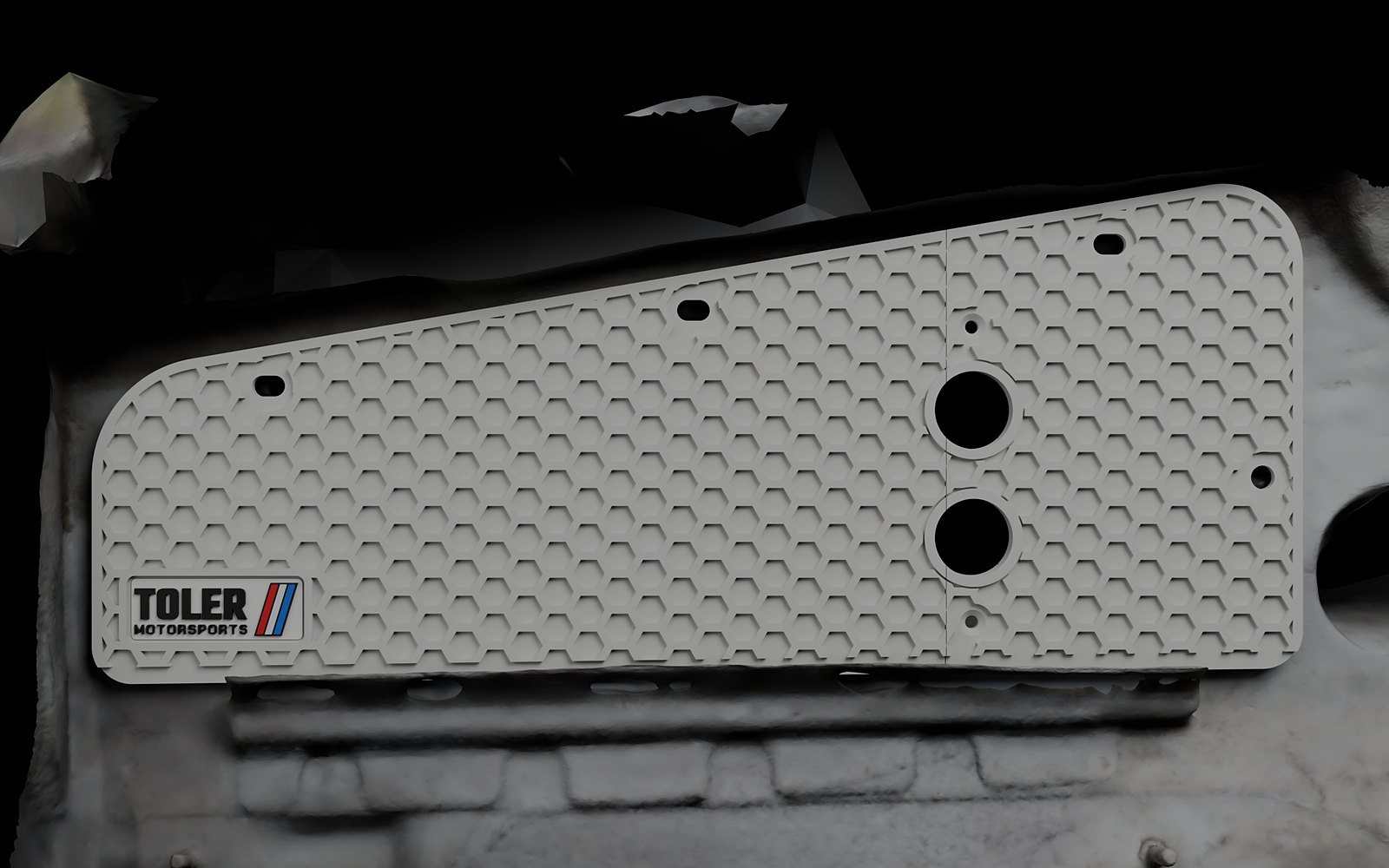 Block off plate with two loom holes in the E36 cowl slot, front view