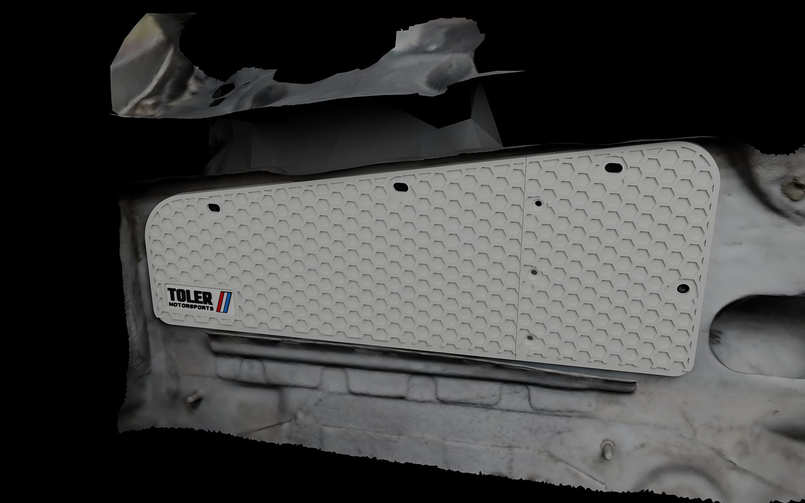 Block off plate with no holes, three quarter view on the car